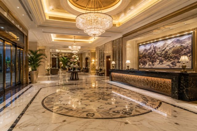 opulent hotel lobby with chandeliers