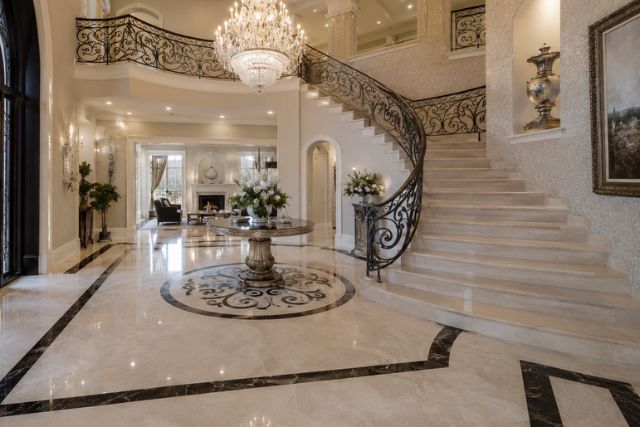 opulent mansion foyer with grand staircase